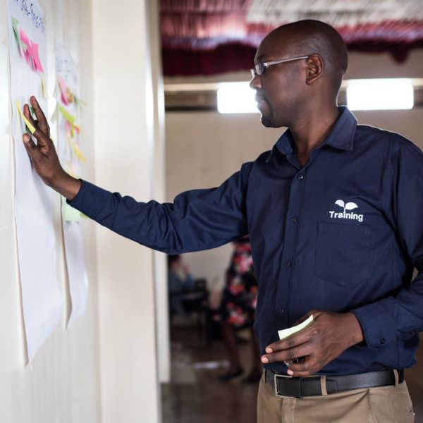 A member of One Acre Fund's staff training team