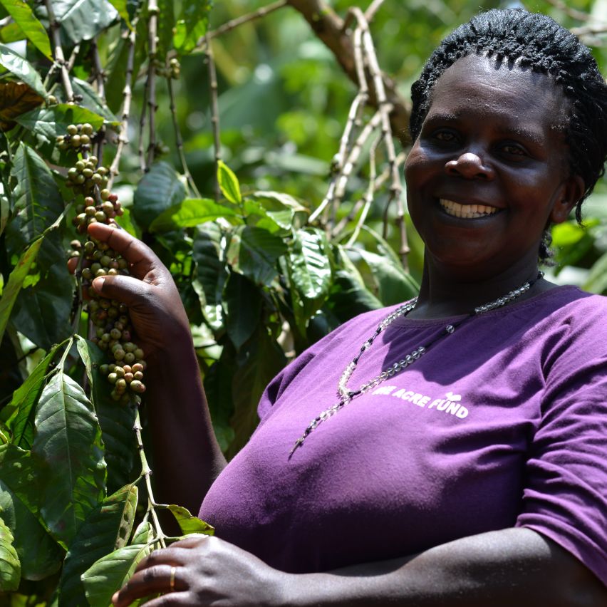 Nang’endo Margaret stands next to her coffee bush in Uganda