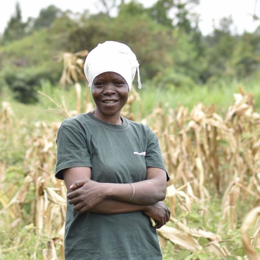 Teresa Otsieno stands in her field in Kenya