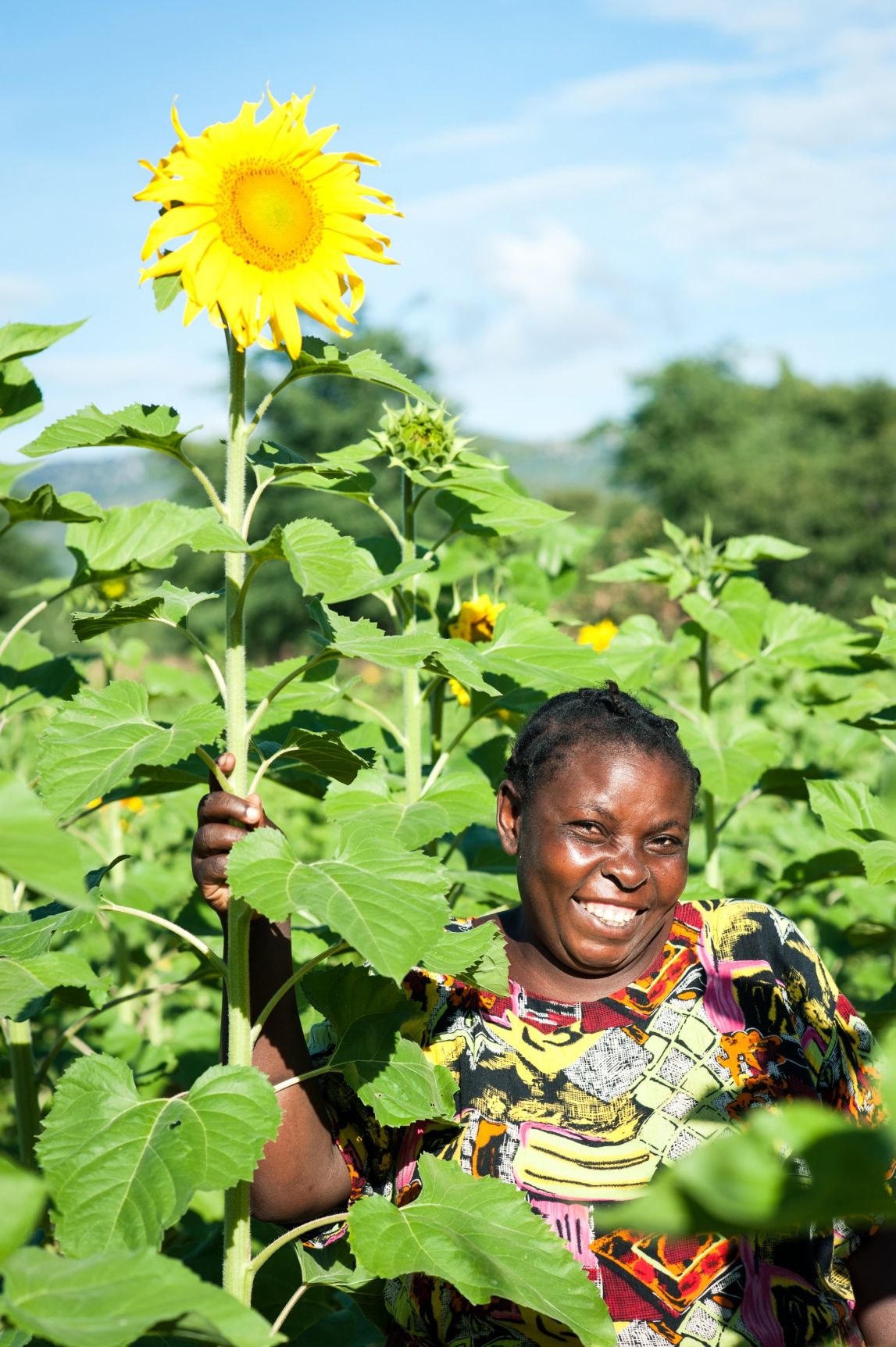 Mwanaidi Kisegelo showing off her sunflowers