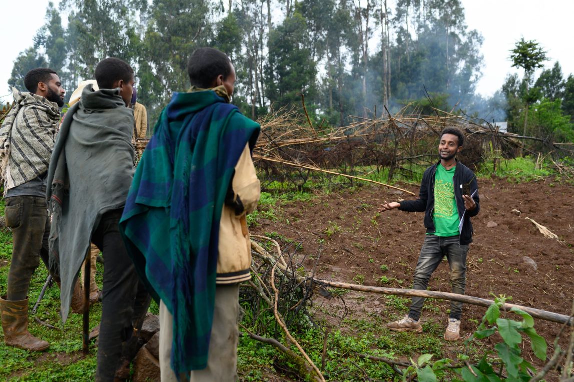 Farmers in Ethiopia receive a tree training from one of our field staff