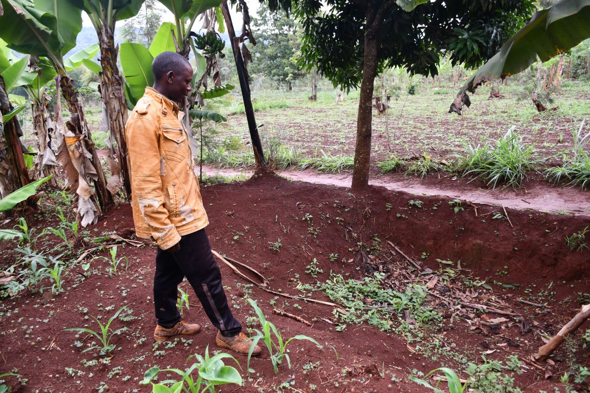 Farmer Angelo Hafashimana stands in his field in Burundi