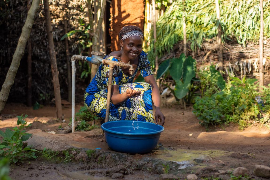 Claudine Ayinkamiye with her new running water tap